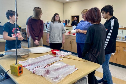 Ms. Nelson teaches iLEAD students about the art of lefse-making.