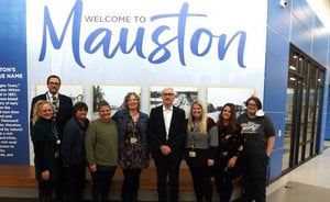 Governor Evers takes a photo with West Side and Montessori Staff.