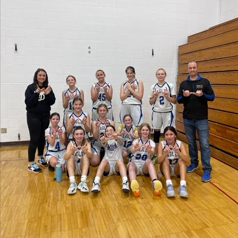 Olson Middle School Girls Basketball Team poses for a picture.