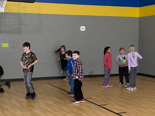 Lyndon Station students play in the gym.