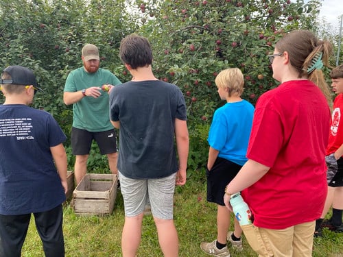 iLEAD students visit an orchard.