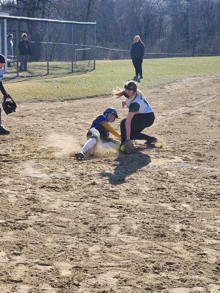 Mauston softball player is tagged out at home plate.
