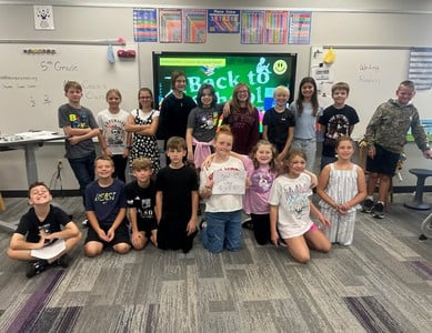 Mrs. Crook's Class pose with a Best 1st Day Ever Sign.