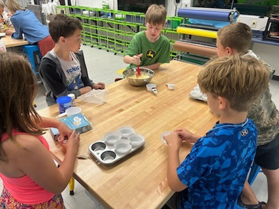 Students baking for the bake sale in the Makerspace.