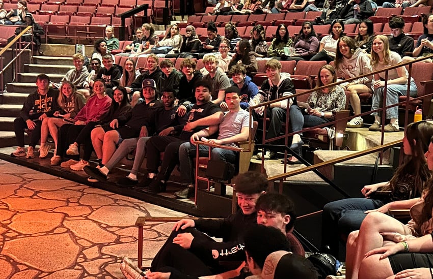 A large group of high school students sitting in a theater during a field trip to UW Madison.